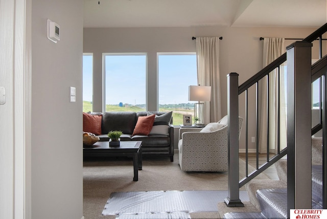 living room featuring stairs