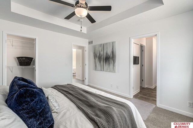 8238 N 175th St, Bennington, NE 68007 - bedroom with visible vents, a tray ceiling, a closet, carpet flooring, and baseboards
