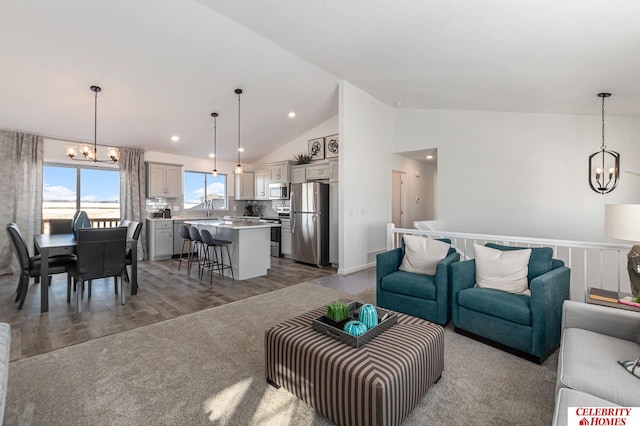 8238 N 175th St, Bennington, NE 68007 - living area with recessed lighting, wood finished floors, high vaulted ceiling, and a chandelier