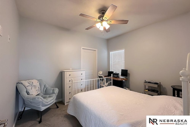 bedroom featuring ceiling fan and carpet