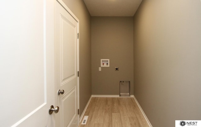 laundry area with baseboards, laundry area, light wood-style flooring, electric dryer hookup, and washer hookup