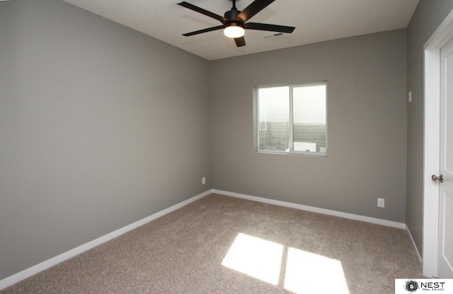 unfurnished room with visible vents, a ceiling fan, baseboards, and carpet floors