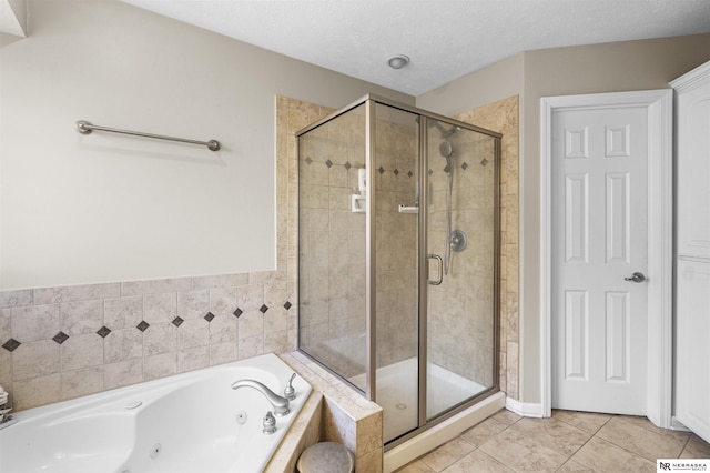 bathroom featuring tile patterned flooring, a shower stall, a whirlpool tub, and a textured ceiling