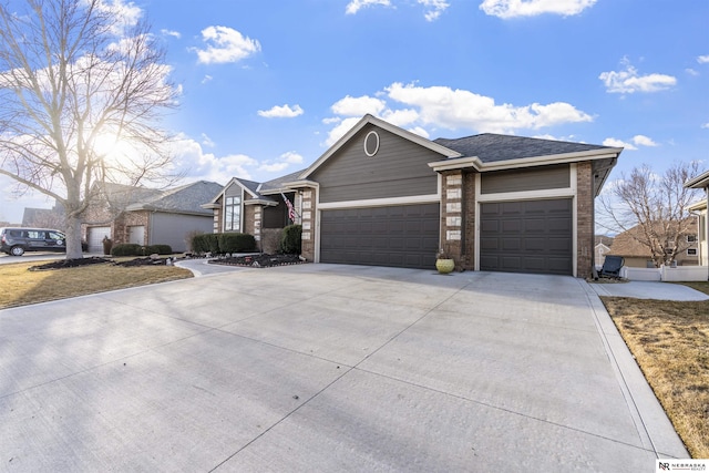 ranch-style house with brick siding, concrete driveway, a garage, and roof with shingles