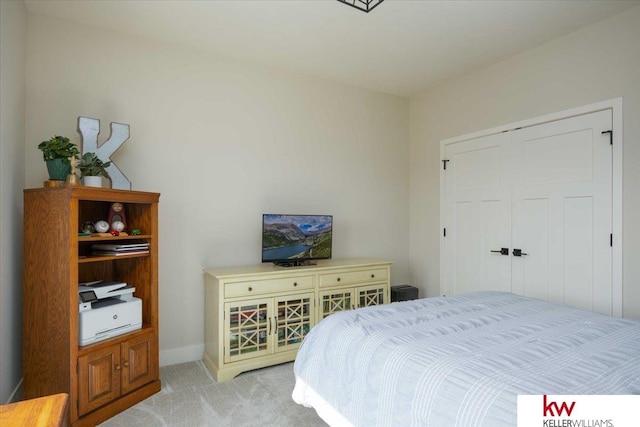 carpeted bedroom featuring a closet