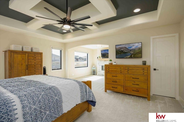 bedroom with ceiling fan, light carpet, recessed lighting, arched walkways, and coffered ceiling