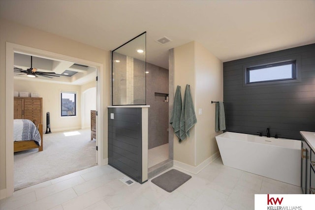 ensuite bathroom featuring visible vents, a walk in shower, a wealth of natural light, a soaking tub, and ensuite bath