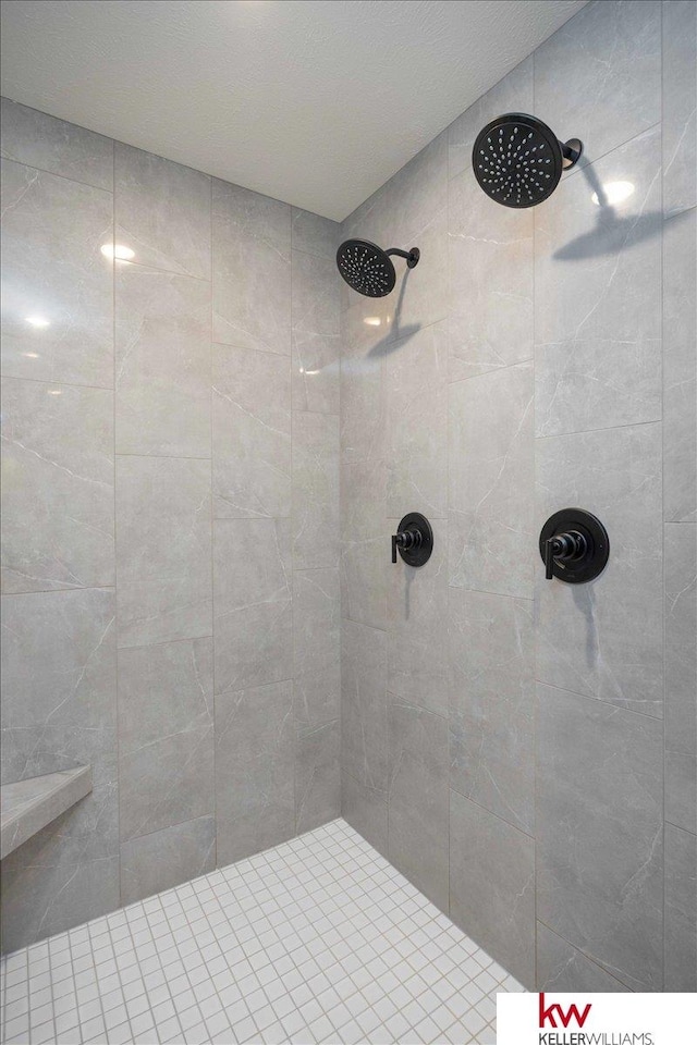 bathroom with tiled shower