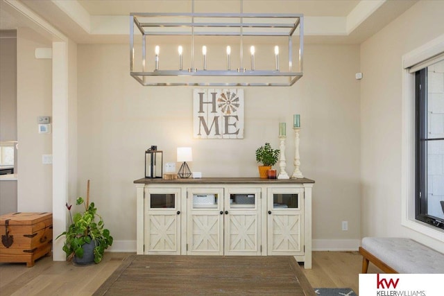 interior space with baseboards and wood finished floors