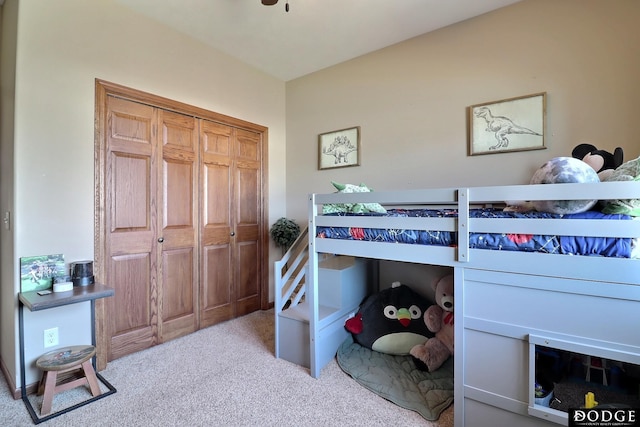 carpeted bedroom with a closet