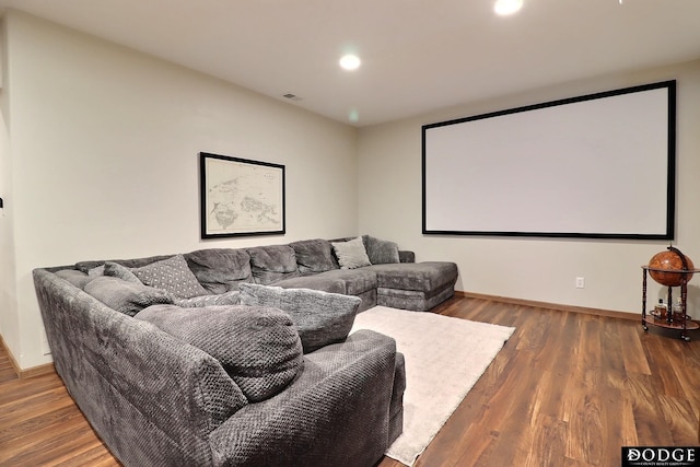 cinema room with recessed lighting, visible vents, baseboards, and wood finished floors