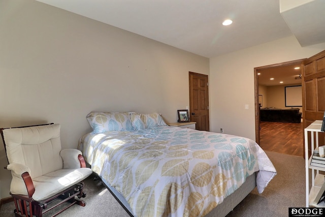 bedroom featuring wood finished floors and recessed lighting