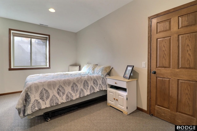 bedroom with recessed lighting, visible vents, light colored carpet, and baseboards