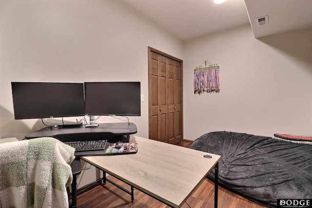 home office with visible vents and wood finished floors