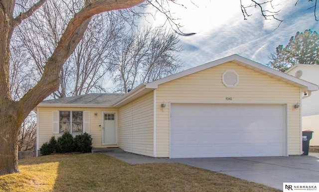 ranch-style home featuring a garage and a front yard