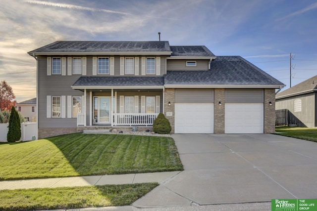 view of front facade with covered porch, roof with shingles, an attached garage, concrete driveway, and a front yard