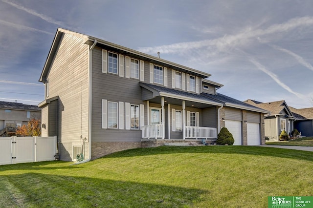 view of front of house with a front lawn, a gate, fence, and covered porch