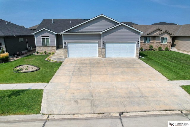 view of front facade featuring stone siding, driveway, an attached garage, and a front yard