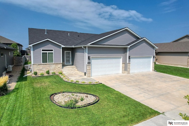 view of front of house with stone siding, driveway, a front yard, and a garage