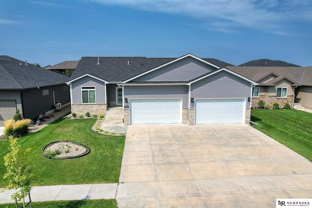 view of front of house with stone siding, driveway, and a front yard