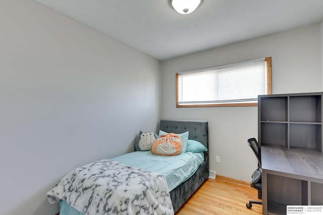 bedroom with wood finished floors