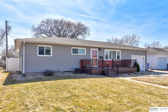 single story home featuring a garage and a front yard