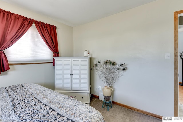 carpeted bedroom with baseboards