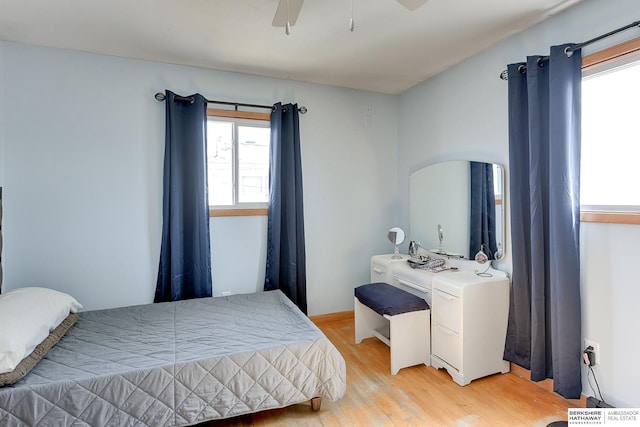 bedroom with ceiling fan and light wood finished floors