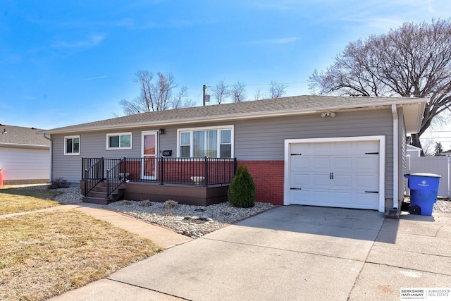 ranch-style house featuring a front lawn, brick siding, concrete driveway, and an attached garage