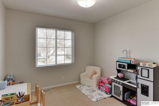 playroom featuring visible vents, carpet floors, and baseboards