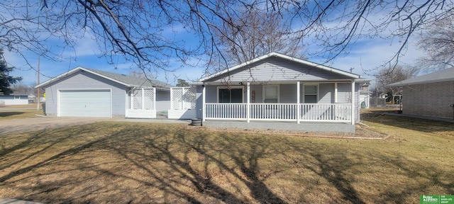 view of front of home featuring a porch, an attached garage, driveway, and a front yard