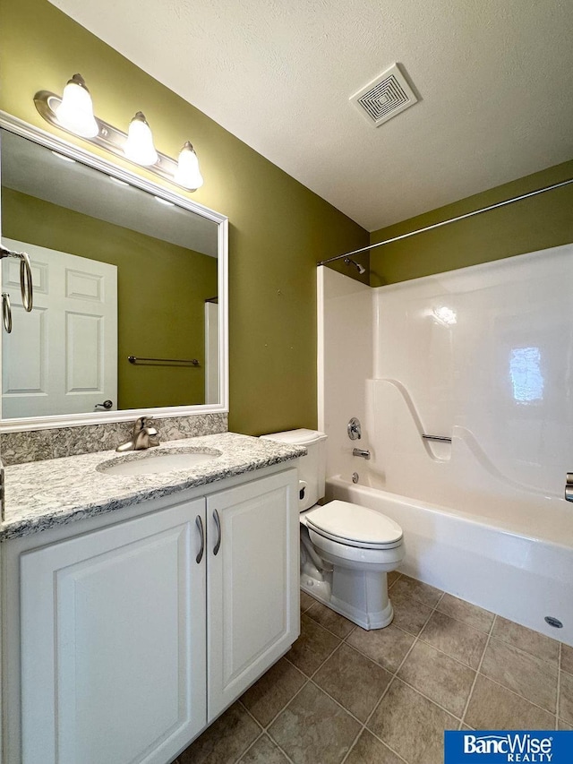 full bathroom featuring visible vents, toilet, a textured ceiling, tile patterned flooring, and vanity