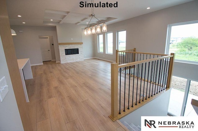 corridor with an upstairs landing, coffered ceiling, recessed lighting, light wood finished floors, and baseboards