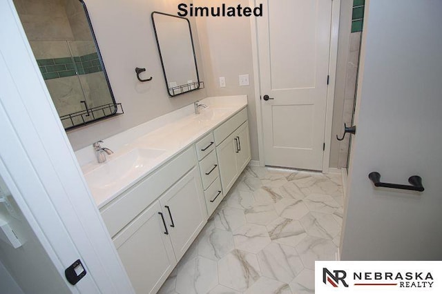 bathroom featuring a sink, a shower, marble finish floor, and double vanity