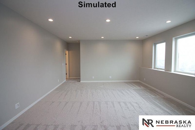 carpeted empty room with recessed lighting and baseboards