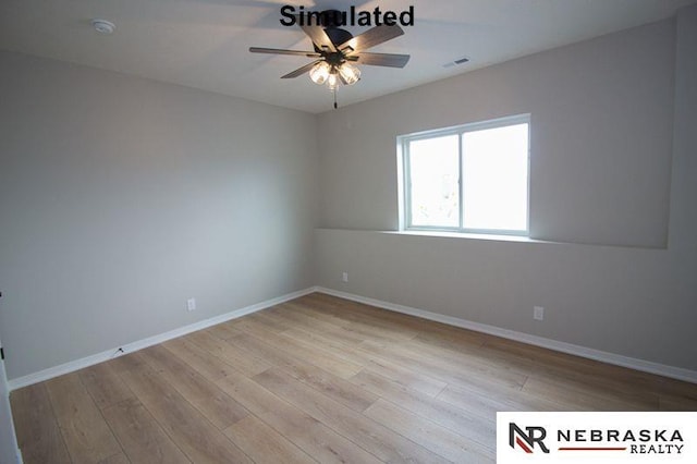 unfurnished room with visible vents, baseboards, light wood-type flooring, and ceiling fan