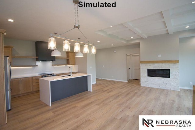 kitchen featuring coffered ceiling, open shelves, a sink, light wood-style floors, and appliances with stainless steel finishes