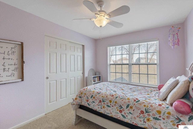 bedroom featuring a closet, carpet floors, baseboards, and ceiling fan