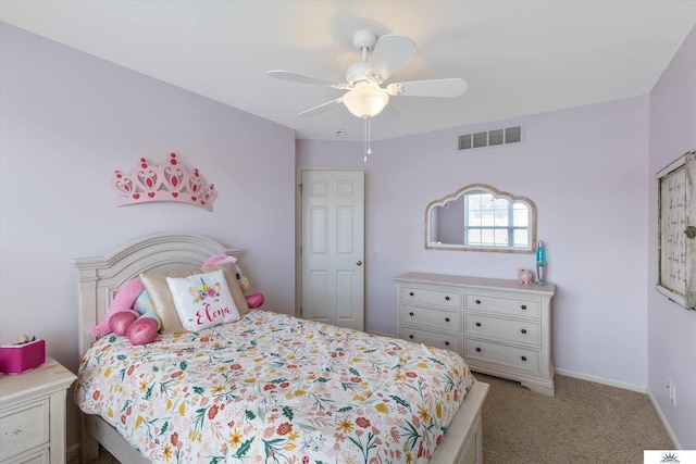 bedroom with visible vents, baseboards, light colored carpet, and a ceiling fan