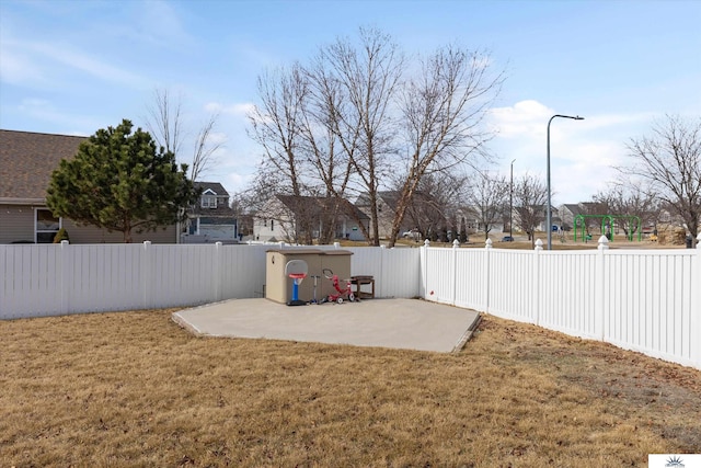 view of yard with a patio area and a fenced backyard