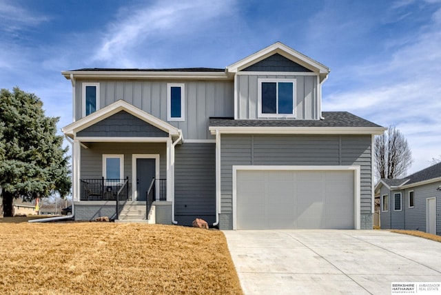 view of front of house with a porch, a garage, board and batten siding, and driveway