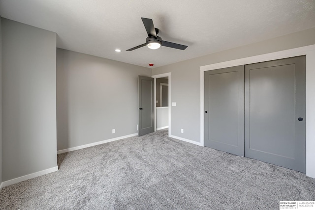 unfurnished bedroom with ceiling fan, baseboards, carpet flooring, recessed lighting, and a closet