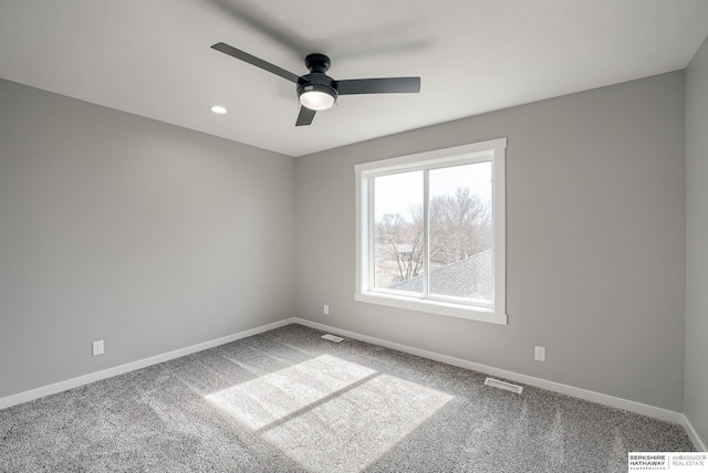 carpeted empty room with visible vents, recessed lighting, baseboards, and ceiling fan