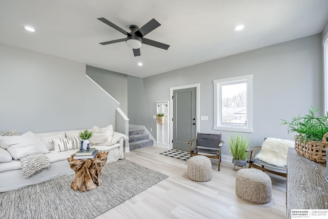 living area with recessed lighting, stairs, a ceiling fan, and wood finished floors