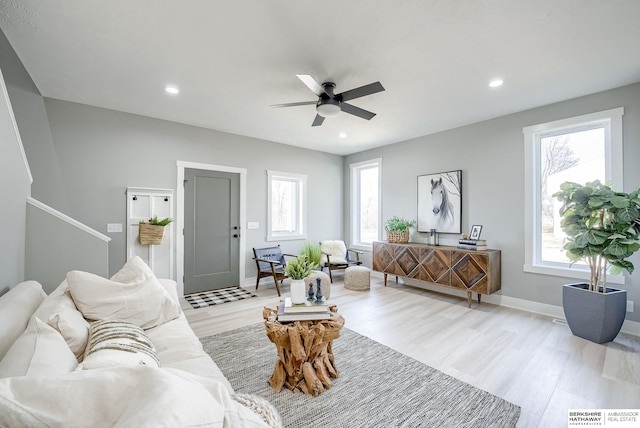 living room featuring light wood-style flooring, recessed lighting, baseboards, and ceiling fan