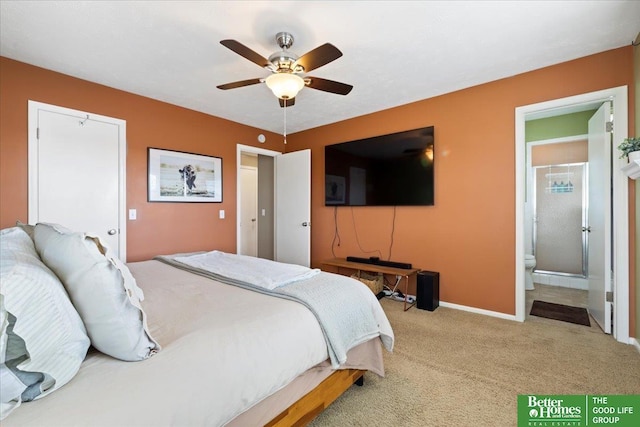 bedroom featuring carpet flooring, baseboards, ensuite bathroom, and ceiling fan