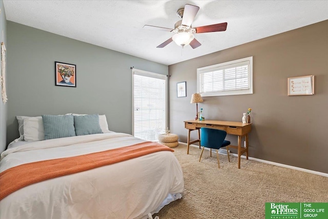 bedroom featuring a ceiling fan, baseboards, and carpet floors