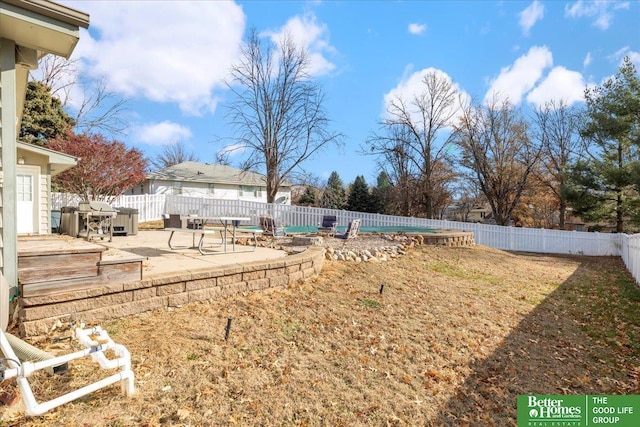 view of yard featuring a patio and a fenced backyard