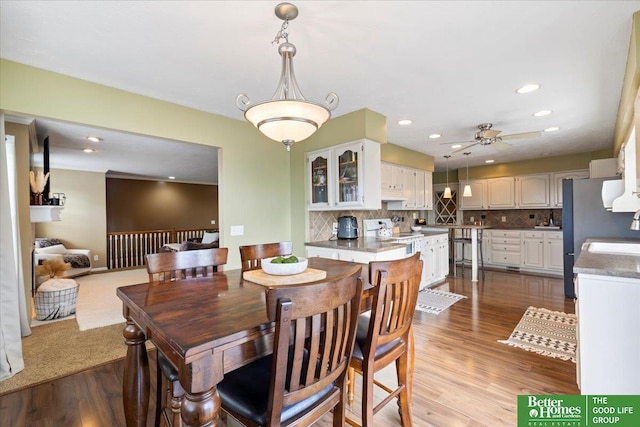 dining space featuring recessed lighting, wood finished floors, and ceiling fan