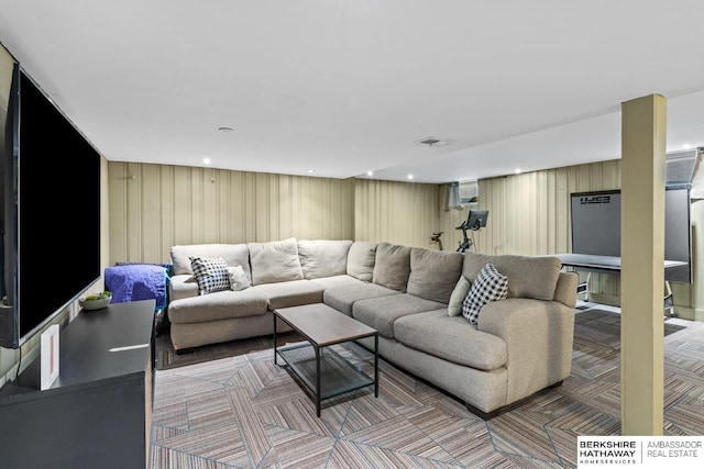 living area featuring recessed lighting, visible vents, and light colored carpet